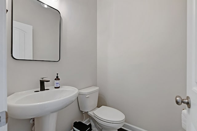 bathroom with toilet and sink