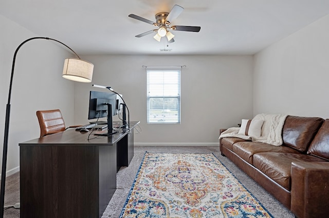 office featuring light carpet and ceiling fan