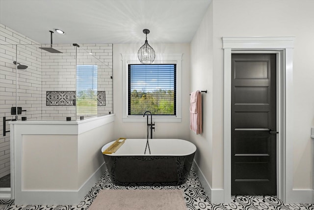 bathroom featuring a chandelier, independent shower and bath, and tile patterned floors