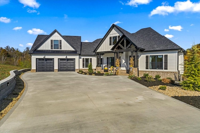 1878 Ferry Hill Rd, Dandridge, TN 37725 - modern inspired farmhouse featuring board and batten siding, a porch, concrete driveway, a garage, and brick siding