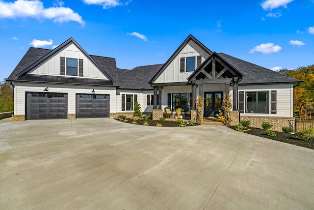 1878 Ferry Hill Rd, Dandridge, TN 37725 - modern inspired farmhouse with board and batten siding, brick siding, driveway, french doors, and a shingled roof