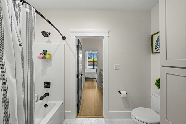 bathroom with toilet, shower / tub combo with curtain, and wood-type flooring