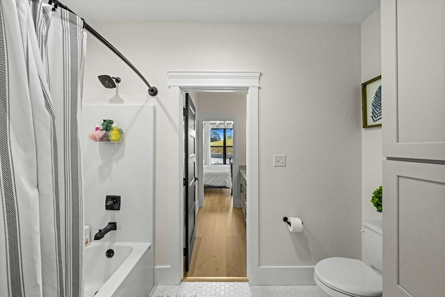 1878 Ferry Hill Rd, Dandridge, TN 37725 - bathroom with toilet, shower / tub combo with curtain, ensuite bathroom, and baseboards