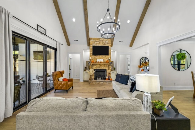 living room featuring a stone fireplace, high vaulted ceiling, and light wood-type flooring