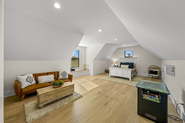 bedroom featuring light hardwood / wood-style flooring and vaulted ceiling