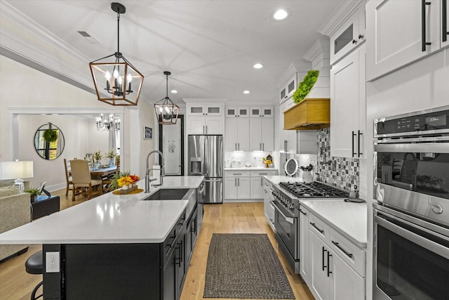 1878 Ferry Hill Rd, Dandridge, TN 37725 - kitchen featuring stainless steel appliances, a chandelier, light wood-style flooring, light countertops, and recessed lighting