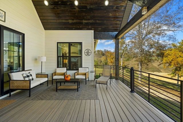 wooden terrace featuring outdoor lounge area