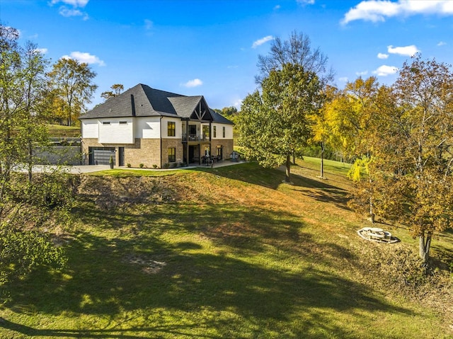 1878 Ferry Hill Rd, Dandridge, TN 37725 - view of grassy yard featuring a balcony, a garage, and driveway