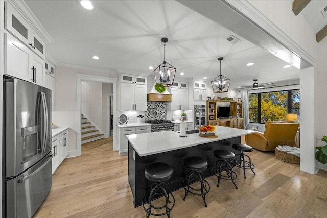 1878 Ferry Hill Rd, Dandridge, TN 37725 - kitchen featuring appliances with stainless steel finishes, light countertops, recessed lighting, a chandelier, and backsplash