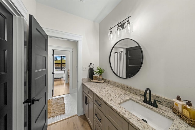 bathroom featuring vanity and wood-type flooring