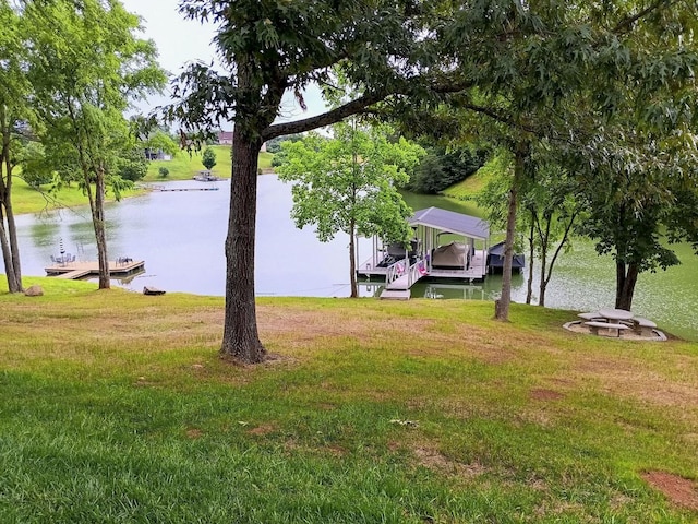 1878 Ferry Hill Rd, Dandridge, TN 37725 - view of grassy yard with a water view, a boat dock, a detached carport, and boat lift