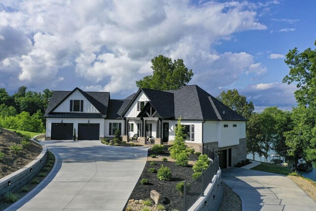 1878 Ferry Hill Rd, Dandridge, TN 37725 - view of front facade with concrete driveway, a garage, board and batten siding, and brick siding