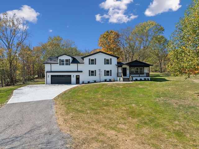 view of front of house featuring a front yard and a garage