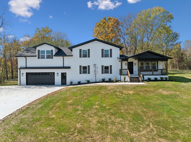 view of front facade featuring a front lawn, covered porch, and a garage