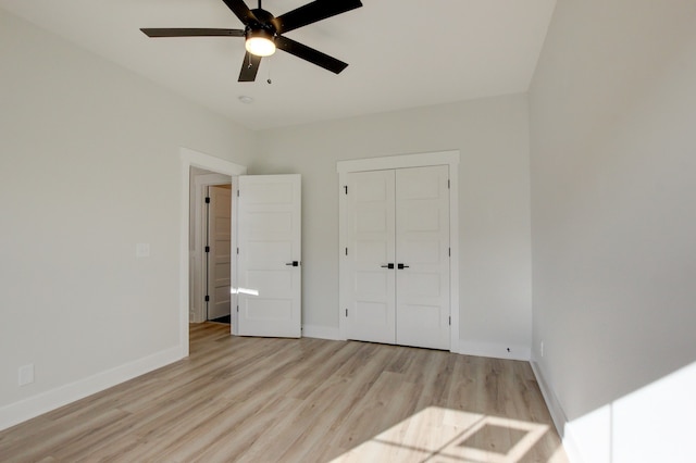 unfurnished bedroom with ceiling fan, a closet, and light hardwood / wood-style flooring