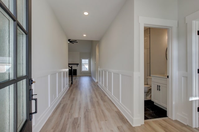 hall with light hardwood / wood-style flooring