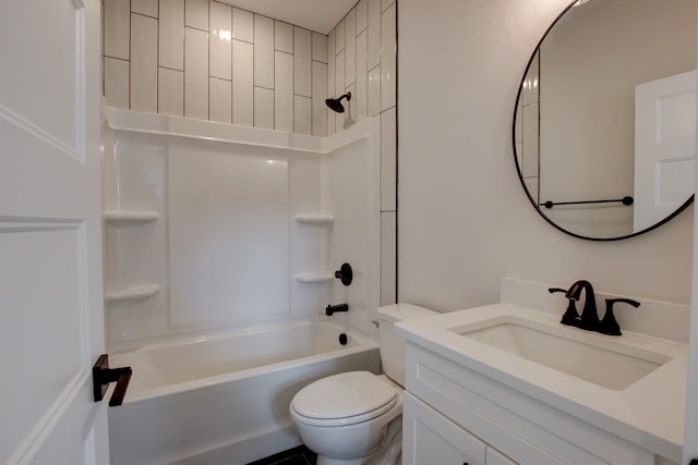 full bathroom with vanity, tiled shower / bath combo, and toilet