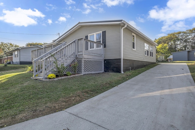 view of property exterior with a yard