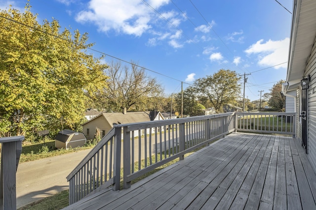 wooden deck with a shed