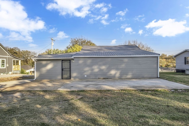 back of property featuring a patio area and a lawn