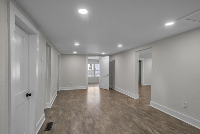 empty room with dark wood-type flooring