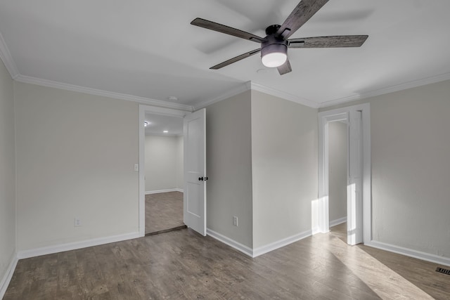 unfurnished room with ornamental molding, hardwood / wood-style flooring, and ceiling fan