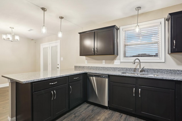 kitchen featuring light stone counters, a peninsula, a sink, dark wood-style floors, and dishwasher