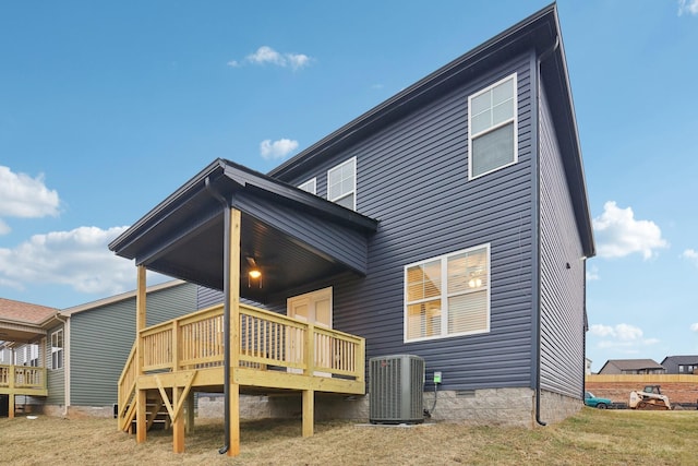 rear view of house featuring crawl space, a wooden deck, and central AC unit