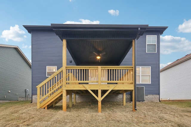 back of property with ceiling fan, stairs, and a wooden deck