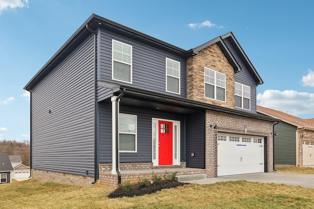 view of front of house featuring a garage, a front yard, brick siding, and driveway