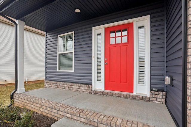 doorway to property with a porch