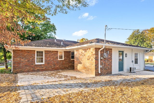 back of property featuring a patio area and cooling unit