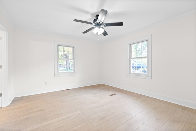 unfurnished room featuring ornamental molding, light hardwood / wood-style floors, and ceiling fan