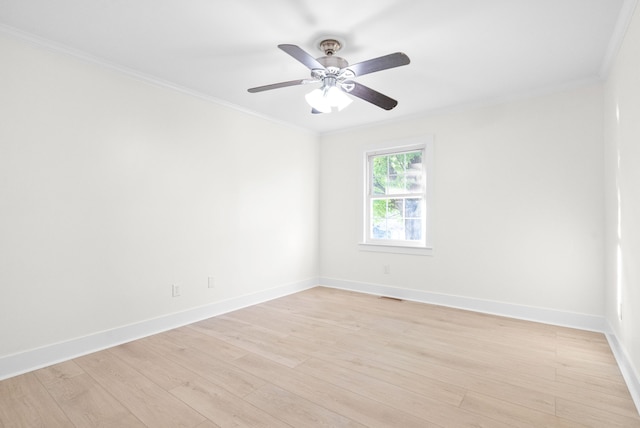 empty room with ceiling fan, ornamental molding, and light hardwood / wood-style flooring