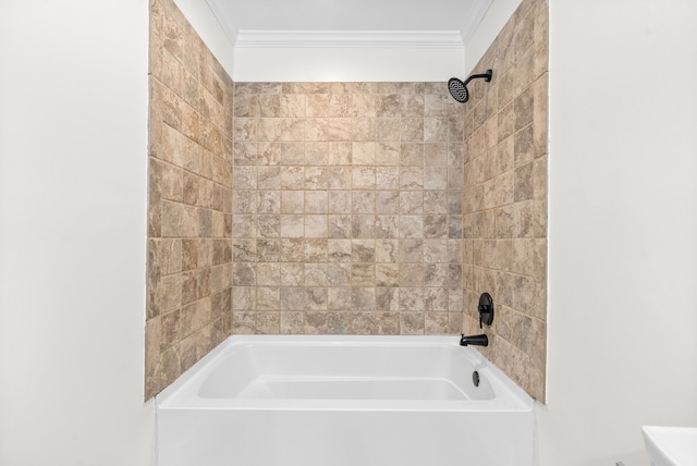 bathroom featuring ornamental molding and tiled shower / bath combo