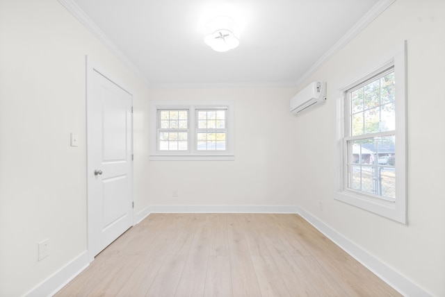 empty room featuring crown molding, light hardwood / wood-style flooring, and a wall mounted air conditioner