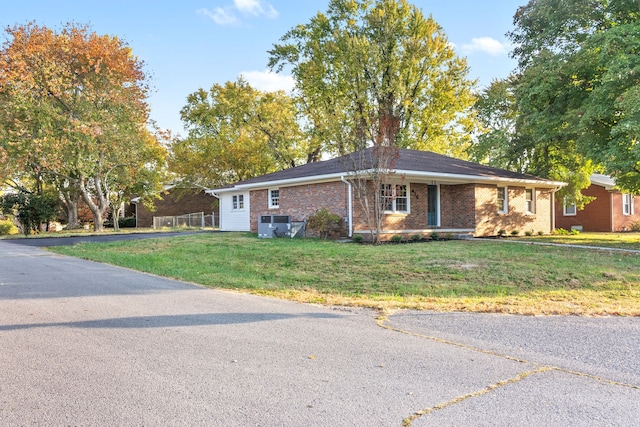 ranch-style home featuring a front yard