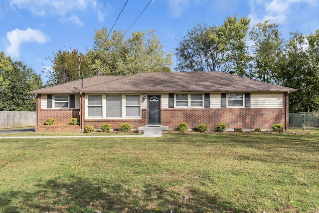 single story home with a front lawn