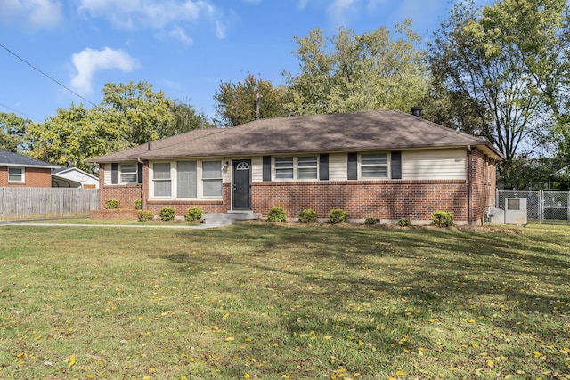 ranch-style home featuring a front lawn