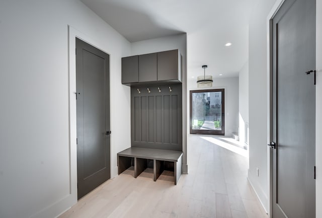 mudroom with light hardwood / wood-style flooring