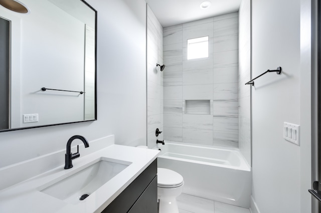 full bathroom with toilet, tiled shower / bath, and vanity