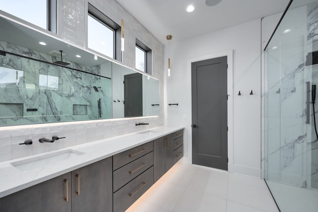 bathroom with vanity, walk in shower, and tile patterned flooring