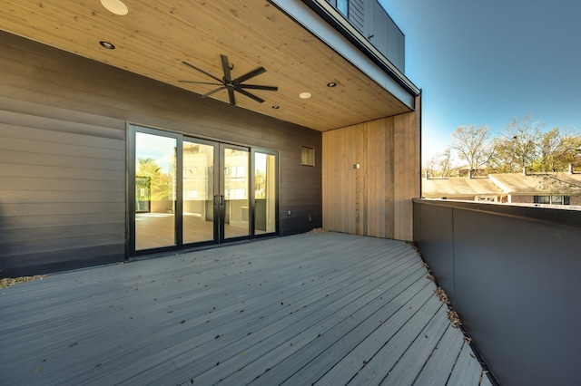 wooden deck featuring ceiling fan