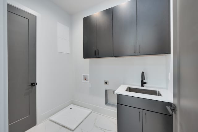 laundry area with sink, electric dryer hookup, washer hookup, and cabinets