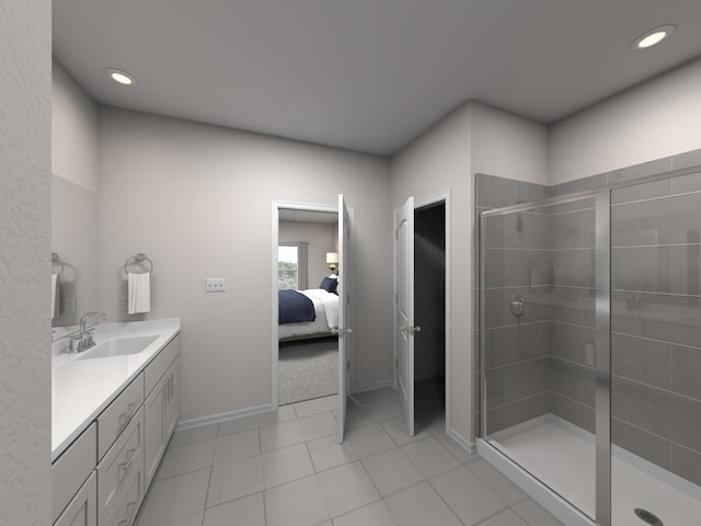 bathroom featuring vanity, a shower with shower door, and tile patterned floors