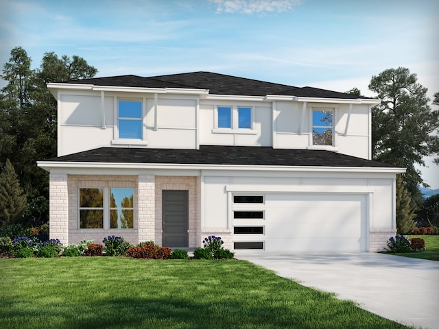 view of front of home with a front lawn and a garage