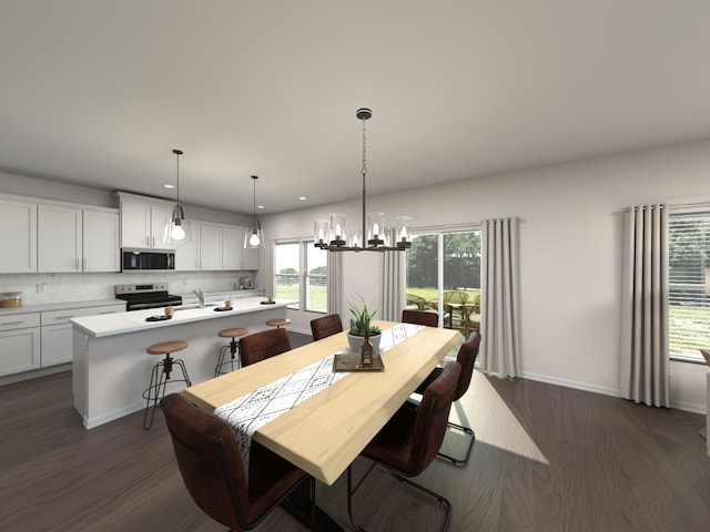 dining room with a healthy amount of sunlight, a chandelier, and dark hardwood / wood-style flooring