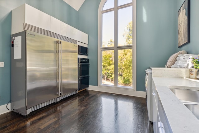31 Annandale, Nashville, TN 37215 - kitchen featuring stainless steel built in fridge, dark wood finished floors, baseboards, a sink, and vaulted ceiling