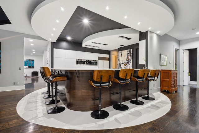 31 Annandale, Nashville, TN 37215 - indoor bar with wood finished floors, baseboards, and recessed lighting