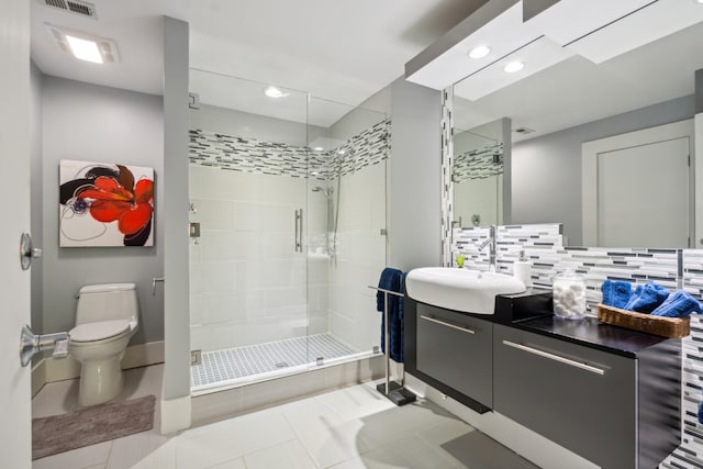 31 Annandale, Nashville, TN 37215 - full bathroom with a shower stall, vanity, toilet, decorative backsplash, and tile patterned floors